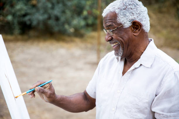 istock Senior African American Man Painting 889046564