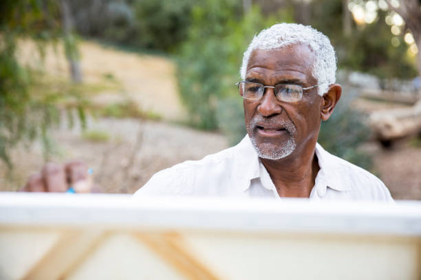 istock Senior African American Man Painting 889046682
