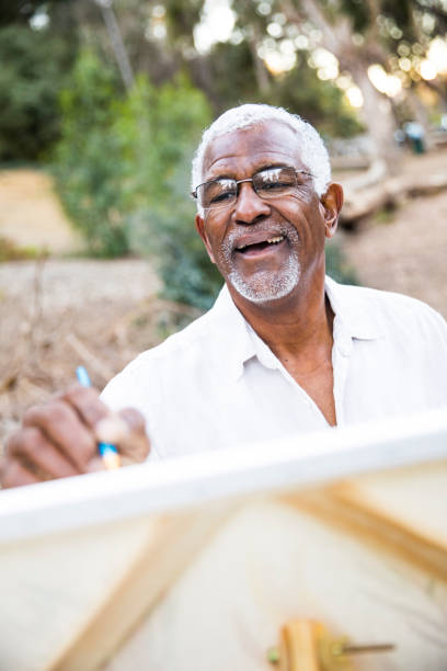 istock Senior African American Man Painting 889048754