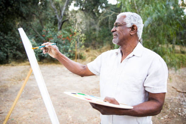 istock Senior African American Man Painting 889048814