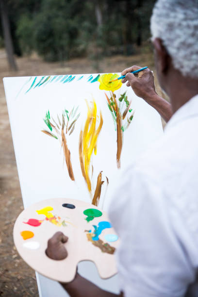 istock Senior African American Man Painting 889048818