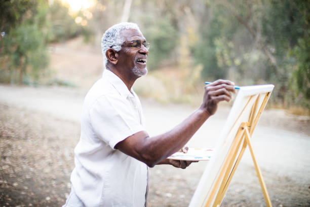 istock Senior African American Man Painting 889048846