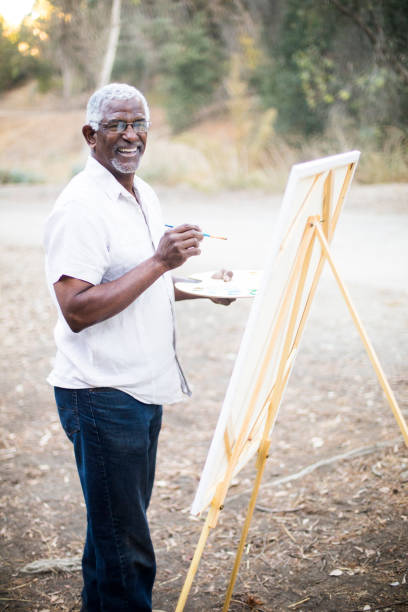 istock Senior African American Man Painting 889048880