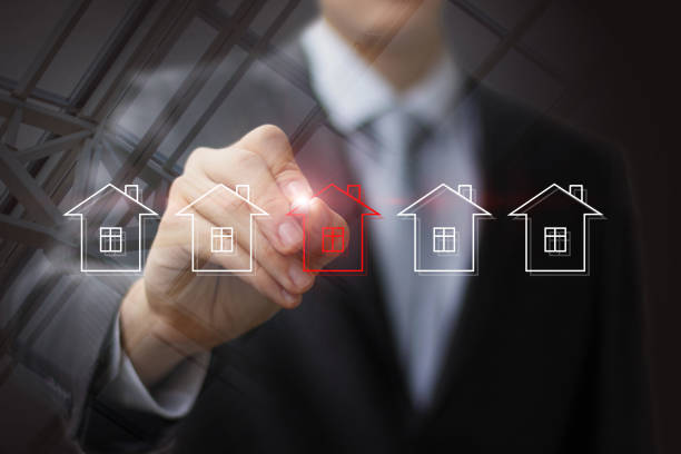 istock Businessman draws house for sale . 889054820
