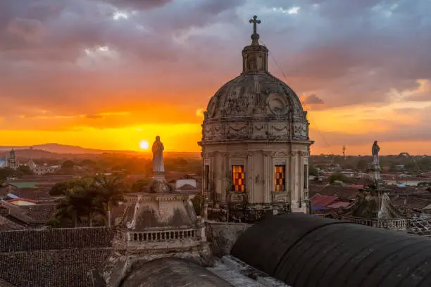 Sunset with a view over the skyline of Granada with the beautiful dome of La Merced church, Nicaragua, Central America.