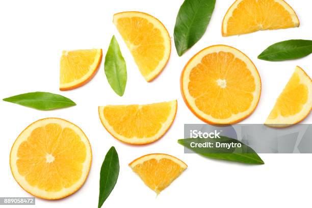 Healthy Food Sliced Orange With Green Leaf Isolated On White Background Top View Stock Photo - Download Image Now