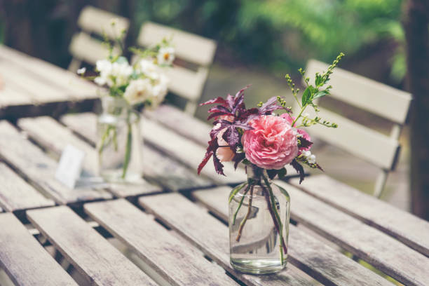 istock Beautiful flowers are arranged on the dinner table. 889058554