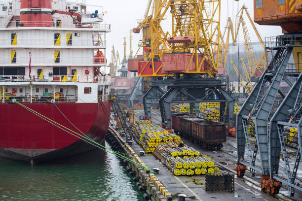 istock Vessel dry cargo on loading, unloading in port. Bulker in port. port terminal. Vessel Balker on loading pipes. Many pipes in port terminal 889058964