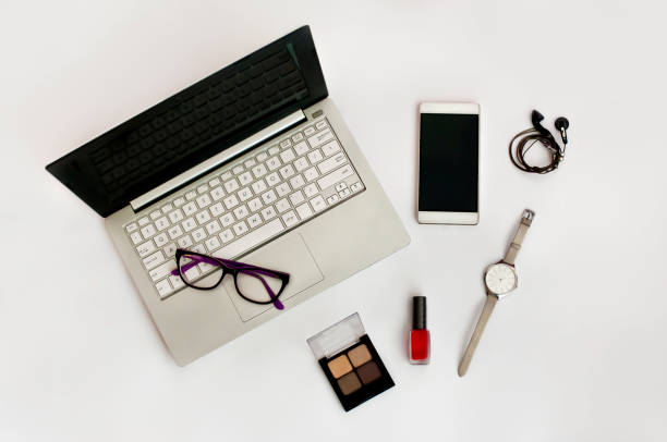 istock Concept of moder femail work place- blogger (background with notebook, smartphone, glasses, nailpolish, watch, shadows, headphones). 889063682
