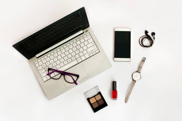 istock Concept of moder femail work place- blogger (background with notebook, smartphone, glasses, nailpolish, watch, shadows, headphones). 889065852