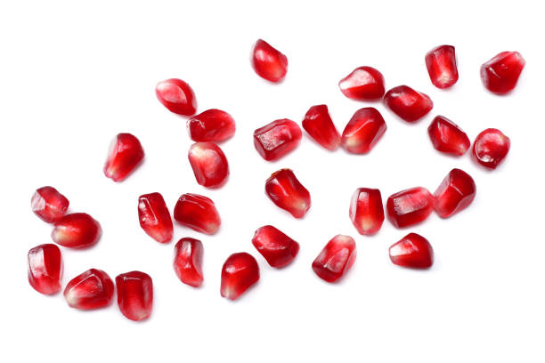 istock pomegranate seeds isolated on white background. top view. pomegranate berries. 889068034