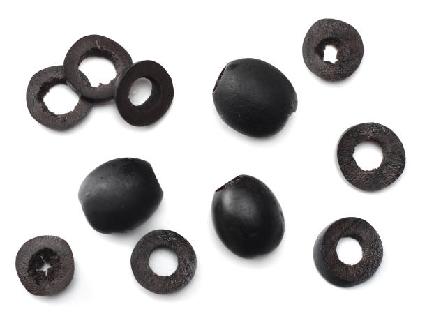 istock Marinated slices black olives isolated on white background. top view 889068258