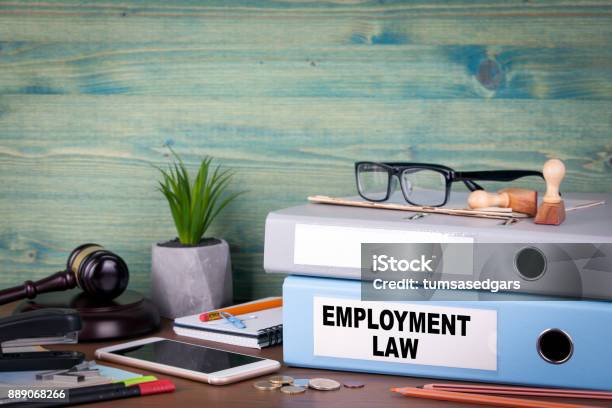 Employment Law Concept Binders On Desk In The Office Business Background Stock Photo - Download Image Now