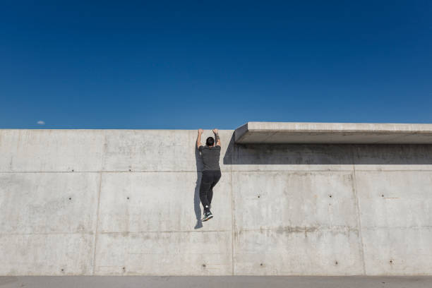 istock Man practicing parkour in the city 889068572