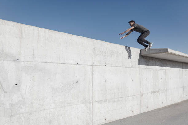 istock Man practicing parkour in the city 889068604