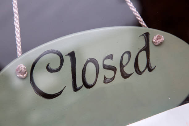 istock Closed Sign on Shop Window 889068768