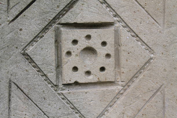 istock Ornate floral stone carving in natural light. 889077582