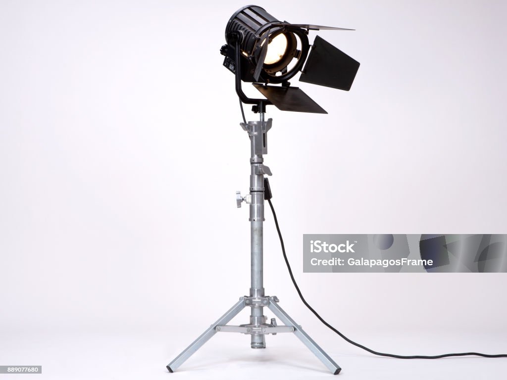 Studio Light on a metal stand. Black Studio Light used in Films or Movies on a metal stand isolated on white background Movie Stock Photo