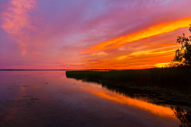 istock Beautiful colorful sunset over the lake 889077962