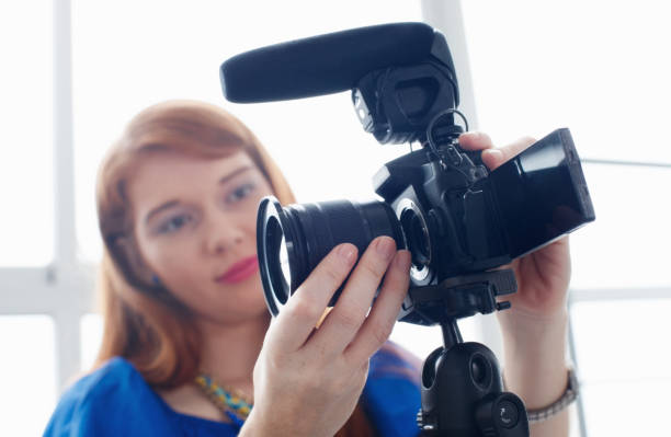 istock Woman Recording Vlog Video Blog Using DSLR Camera 889083698