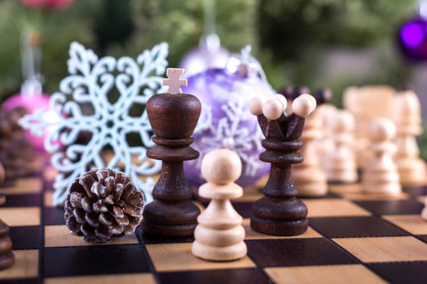 istock Christmas tree and chess board with figures. 889086904