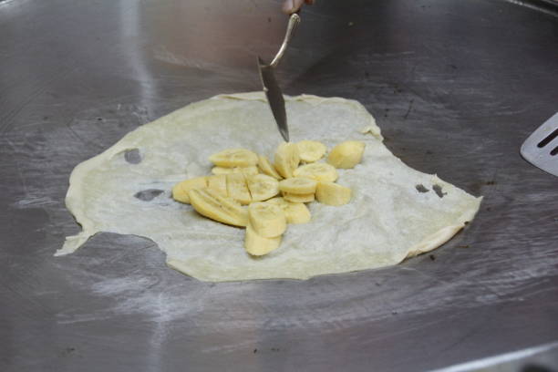 istock Preparation of Banana Roti 889089874