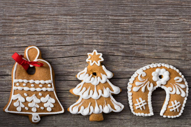 istock Decorated gingerbread Christmas cookies on a wooden background 889095126