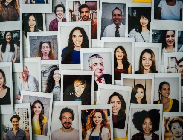 Human resources Polaroid photos of different people hanged on the wall. large group of people stock pictures, royalty-free photos & images