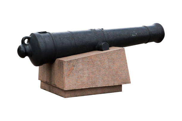 old black cast iron cannon on marble pedestal isolated on white background