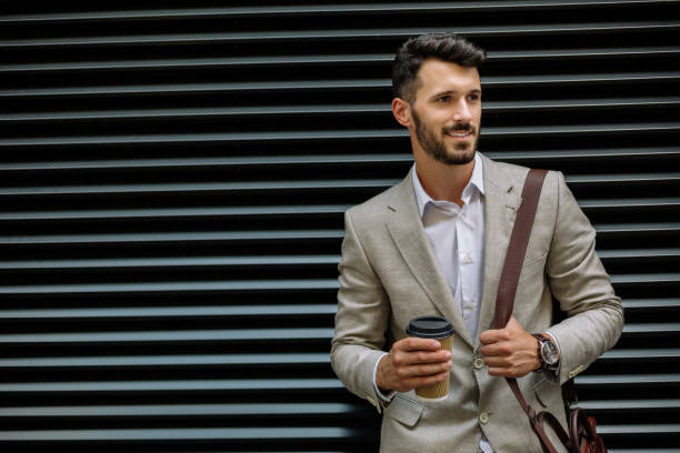 istock Young businessman having coffee to go 889115268