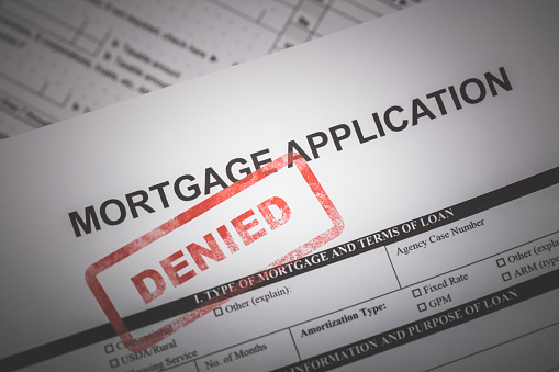 A stock photo of a Mortgage application form with a red \