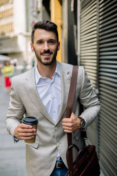 istock Young businessman having coffee to go 889121720