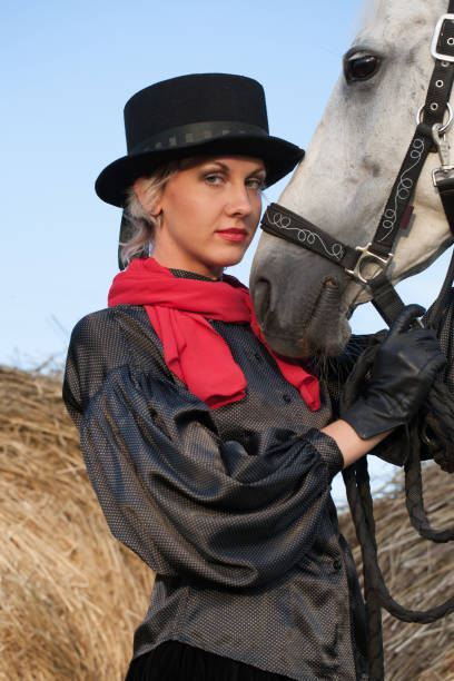 istock young woman embracing horse 889128500