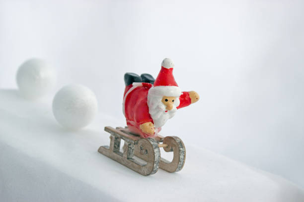 istock Santa Claus on the sledge with snow balls 889136794
