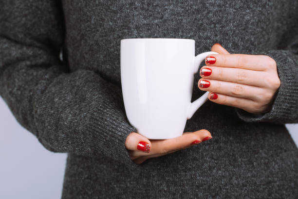 istock Woman holds white coffee cup 889141710
