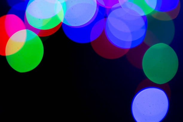 istock Blurred and defocused abstract multicolor background with christmas lights, soft multicolored bokeh circles 889143982