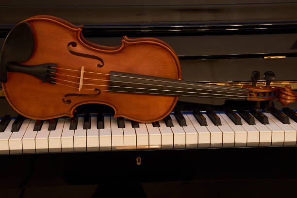 istock Violin lies on the piano 889144140