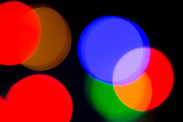 istock Blurred and defocused abstract multicolor background with christmas lights, soft multicolored bokeh circles 889146636