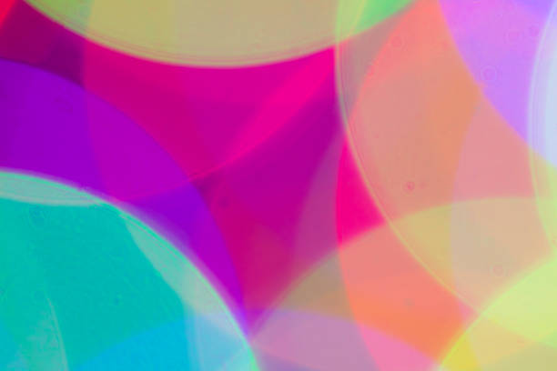 istock Blurred and defocused abstract multicolor background with christmas lights, soft multicolored bokeh circles 889146856
