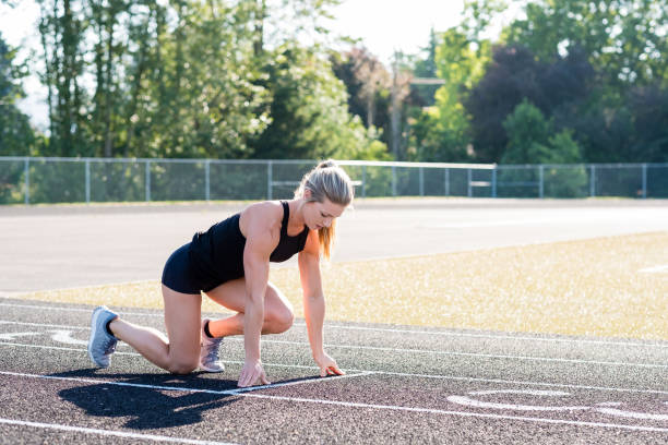 istock Young Female Athlete Working Out on Track 889151972