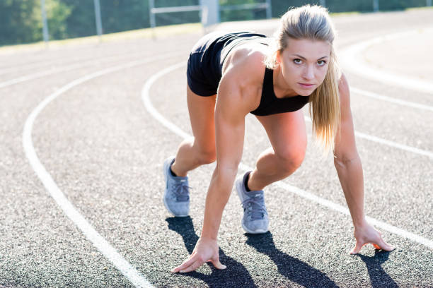 istock Young Female Athlete Working Out on Track 889152252