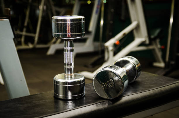 istock Dumbbells on the bench  at the gym 889162740