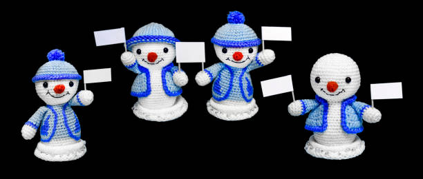istock four happy snowman toys with advertising on a black background, isolate 889166134