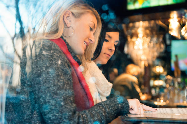 istock Christmas Shopping with two young women 889171348