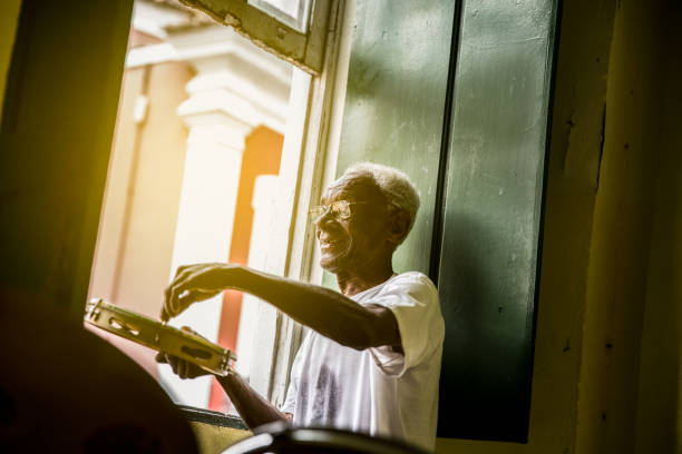 Brazilian senior playing Samba at home