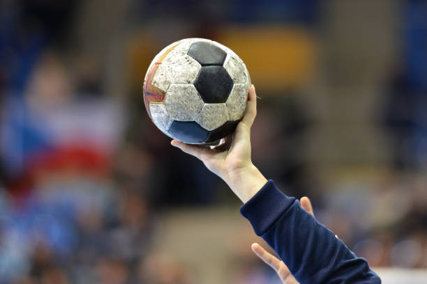 Female Handball Player Female Handball Player holding a handball team handball stock pictures, royalty-free photos & images