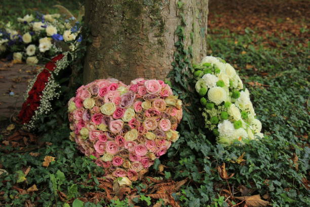 istock Sympathy flowers near a tree 889182656