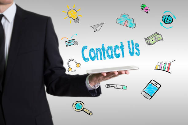 istock Contact Us concept with young man holding a tablet computer 889195658