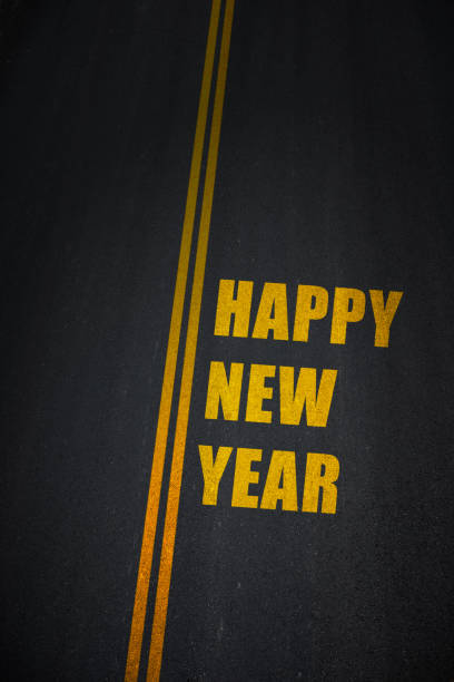istock Happy new year text on asphalt road 889195736