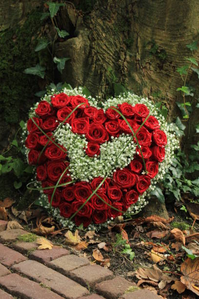 istock Sympathy flowers near a tree 889201050